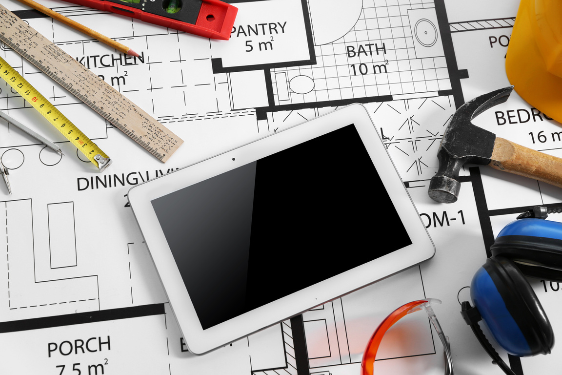 Construction Drawing with Tools and Digital Tablet